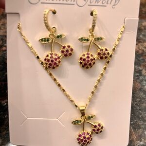 Elegant Cherry Jewelry Set with Gold and red Accents